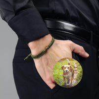 Thumbnail for Man Olive Photo Bracelet on a man's wrist, featuring a circle pendant with a dog photo. By Brother & Sisters.