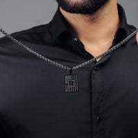 Thumbnail for Military Initial Necklace featuring a black letter pendant on a chain, by Brother & Sisters, symbolizing strength.