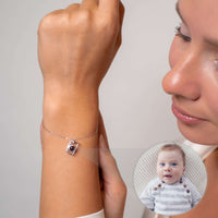Thumbnail for Memories Photo Bracelet featuring a hidden photo projection pendant by Brother & Sisters worn on a woman's wrist.