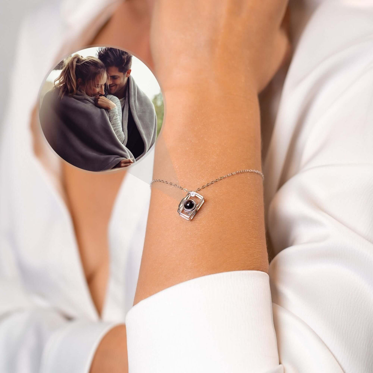 Memories Photo Bracelet from Brother & Sisters displaying a photo projection pendant on a wrist.