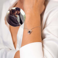 Thumbnail for Memories Photo Bracelet from Brother & Sisters displaying a photo projection pendant on a wrist.