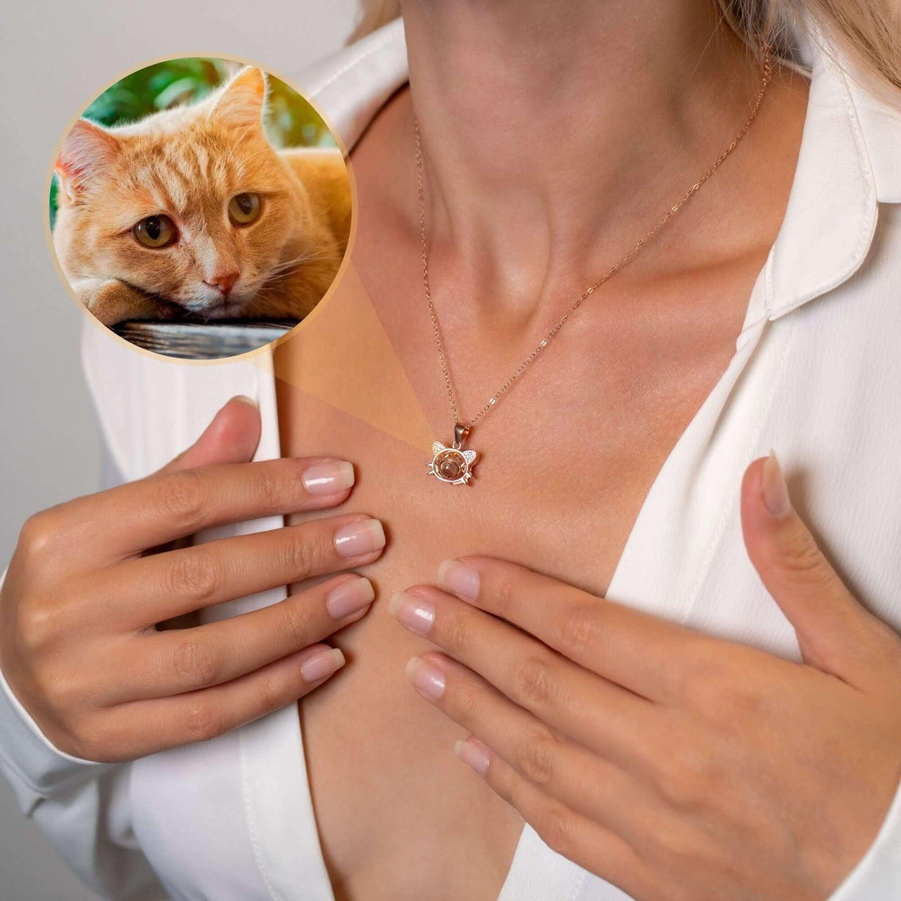 Meow Photo Necklace featuring a personalized cat photo projection by Brother & Sisters worn by a woman.