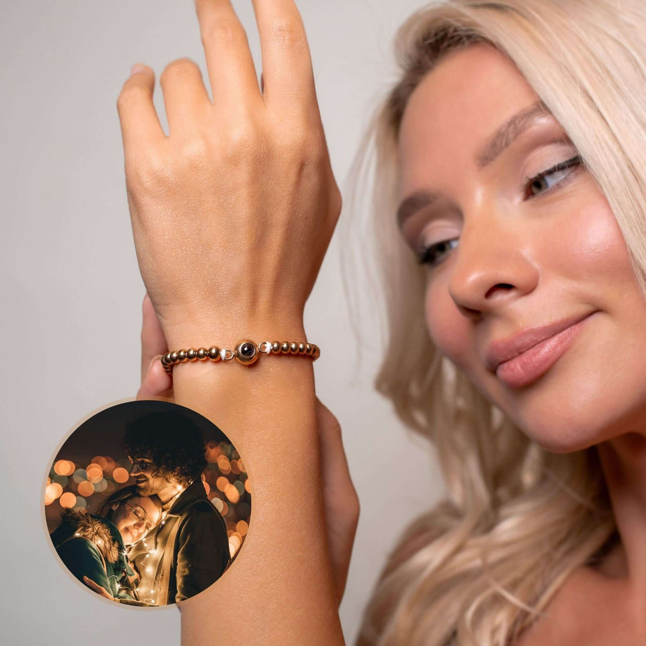 A woman wearing a Metallic Photo Bracelet featuring a cherished photo, showcasing style and sentiment by Brother & Sisters.