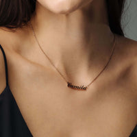 Thumbnail for Minimalist Name Necklace worn by a woman, personalized with the name 'Camila', by Brother & Sisters.