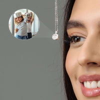 Thumbnail for Close-up of a woman wearing a Moonlight Photo Necklace with a cherished memory photo inside, by Brother & Sisters.