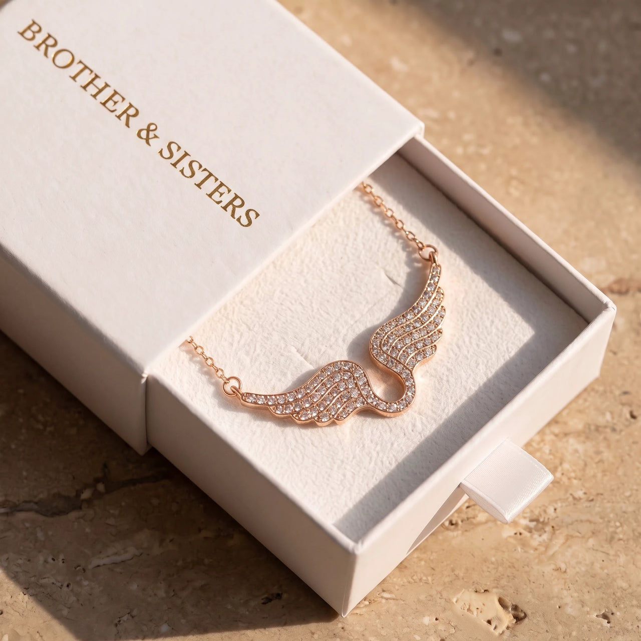 The rose gold necklace in the Brother & Sisters gift box | SKU: 42002-rose-gold