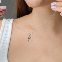 Thumbnail for Paw Name Necklace worn by a woman, featuring a delicate silver chain and personalized charm by Brother & Sisters.