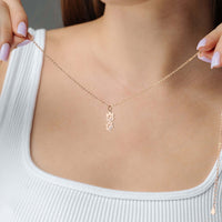 Thumbnail for Paw Name Necklace displayed on a model, showcasing the unique personalized design by Brother & Sisters.
