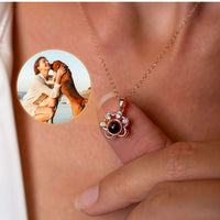 Thumbnail for Paw Print Photo Necklace by Brother & Sisters, showcasing a sentimental paw print pendant with a photo projection.