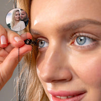 Thumbnail for Close-up of woman holding Photo Personalized Bracelet with photo projection of a couple, by Brother & Sisters.