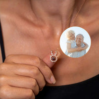 Thumbnail for Close-up of a Reindeer Photo Necklace by Brother & Sisters featuring a cherished photo insert and festive design.