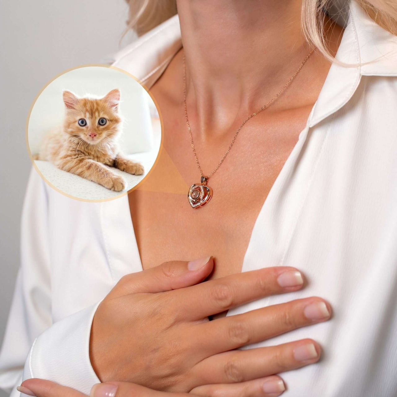 Romance Photo Necklace worn by a woman showcasing a heart pendant with a photo of a cat, by Brother & Sisters.