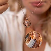 Thumbnail for Romance Photo Necklace featuring a heart-shaped pendant with a photo projection, by Brother & Sisters.