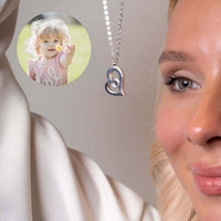 Thumbnail for Romantic Photo Necklace by Brother & Sisters showcasing a heart pendant with a hidden photo of a child.