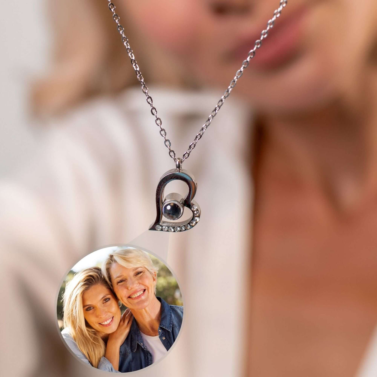 Close-up of a Romantic Photo Necklace featuring a heart pendant with a personalized photo projection by Brother & Sisters.