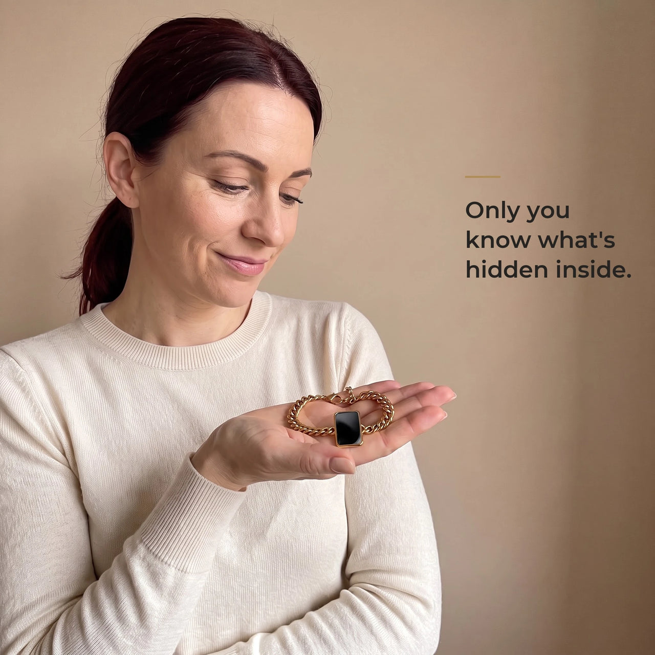 Woman holding the gold cushion-cut bracelet in her palm, its plaque plain black: only you know what's hidden inside | SKU: TPH-CUSB-GOLD
