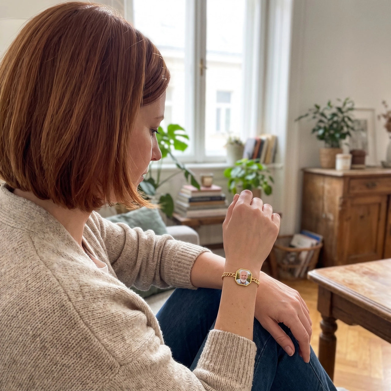 Woman looking at her father's photo in the gold octagon photo bracelet | SKU: TPH-OCTB-GOLD-18