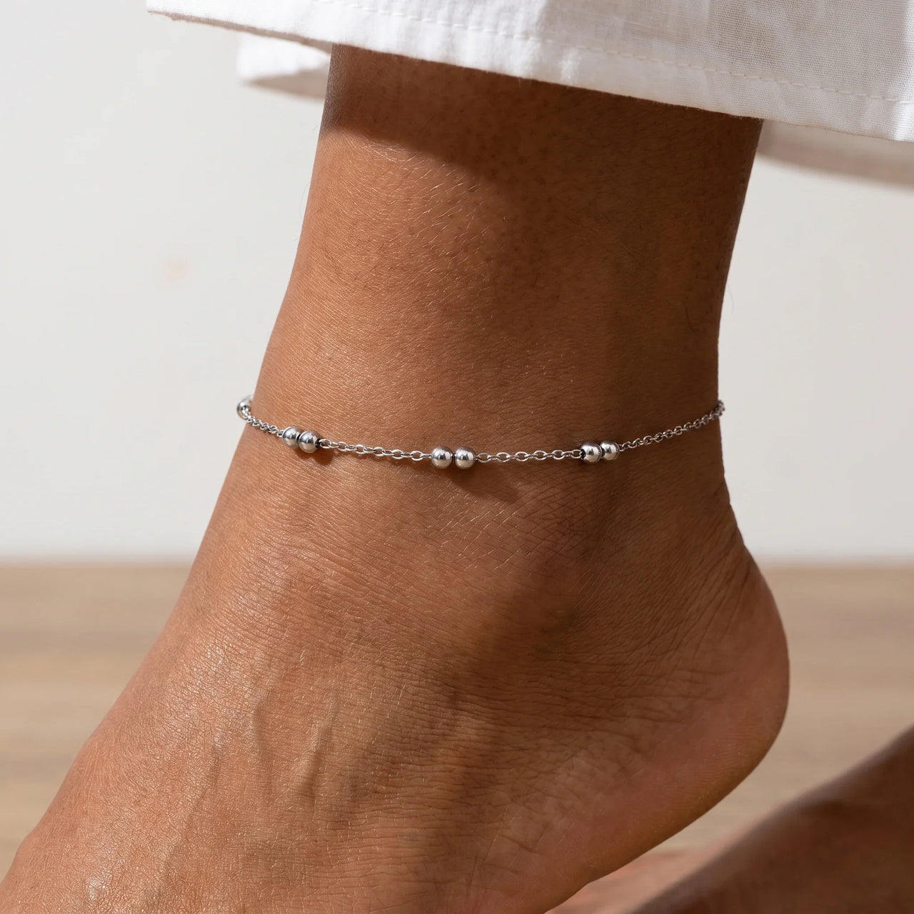 Silver Bead Anklet featuring delicate polished silver beads, perfect for summer afternoons, by Brother & Sisters.