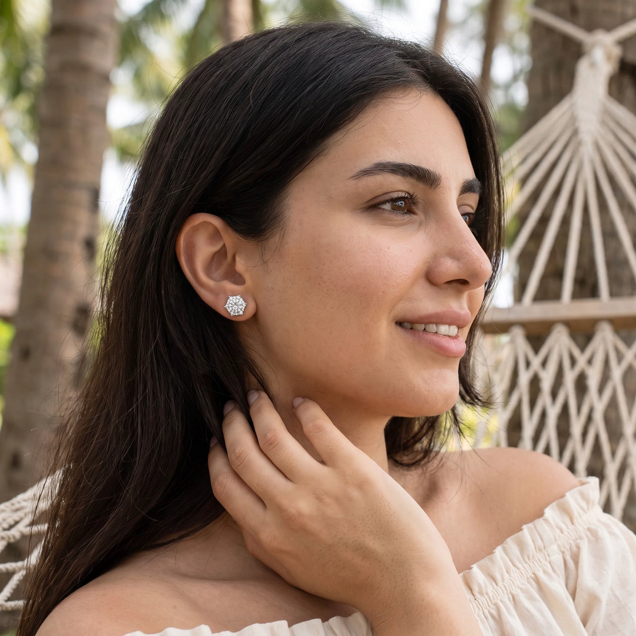 Woman relaxing on holiday wearing the silver stud earrings | SKU: 30876249