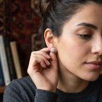 Thumbnail for Woman gently touching her silver stud earrings | SKU: 30876249