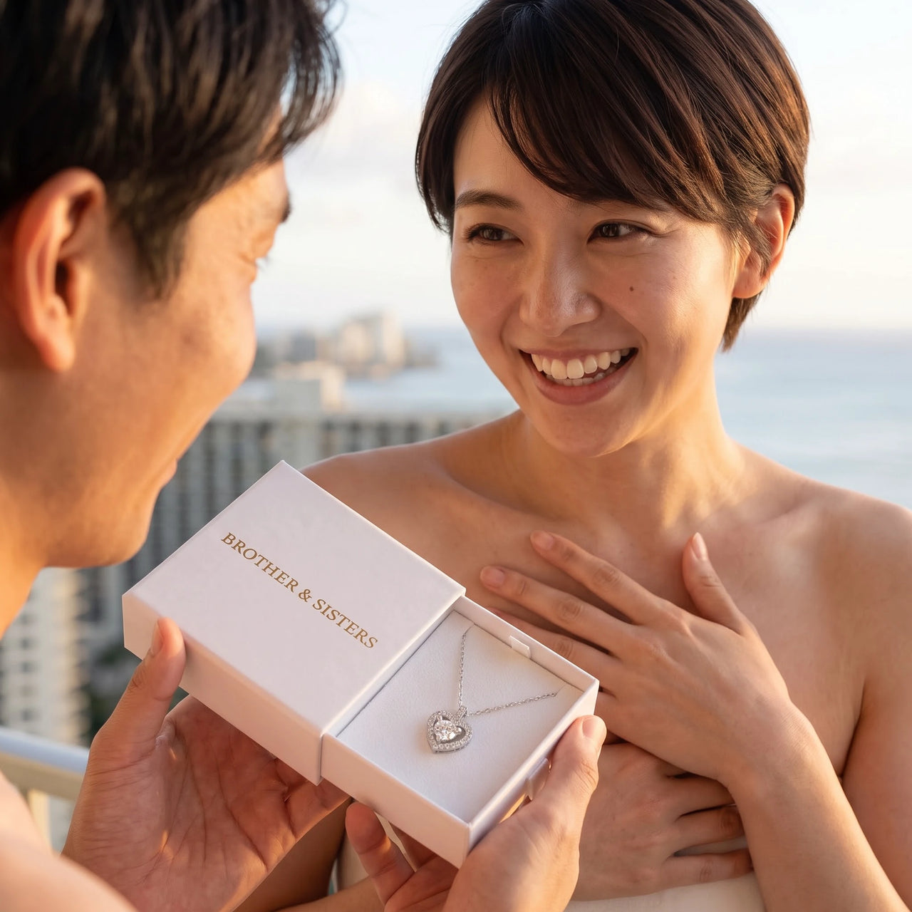He surprises her with the silver necklace in its gift box | SKU: 505744