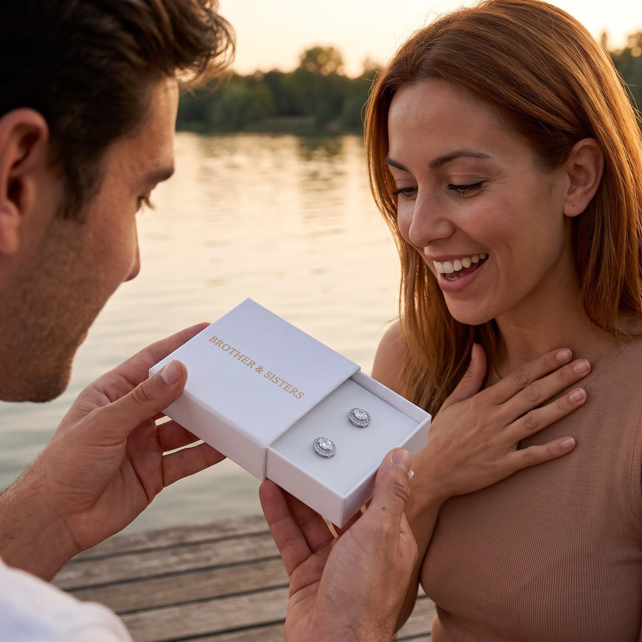 He surprises her with the silver ring in its gift box | SKU: 6306968-white