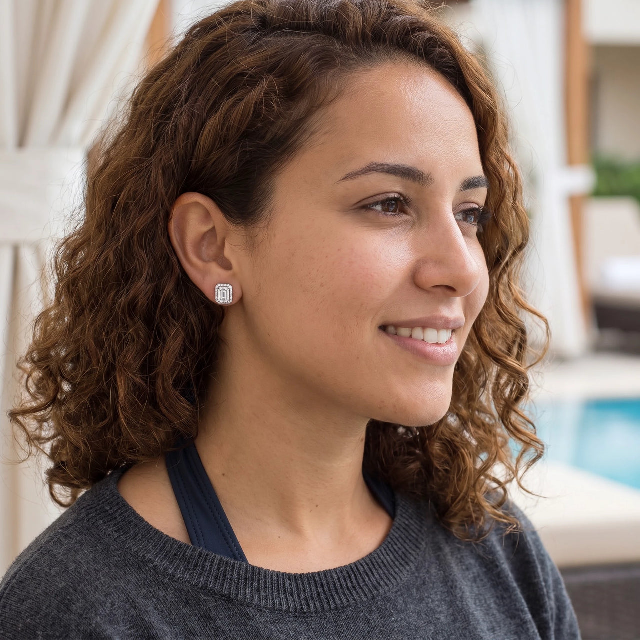 Woman relaxing on holiday wearing the silver stud earrings | SKU: 22683128