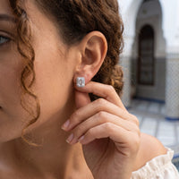 Thumbnail for Woman gently touching her silver stud earrings | SKU: 22683128