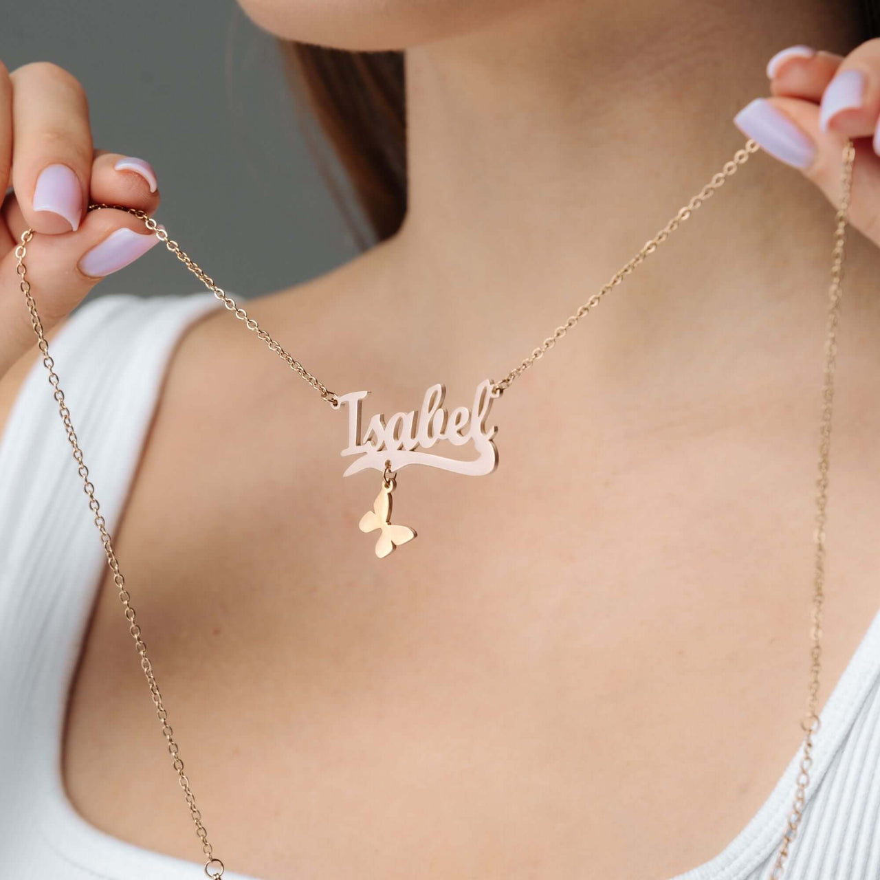 Simple Name Necklace by Brother & Sisters, personalized with the name Isabel and butterfly charm.