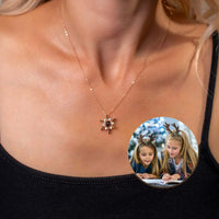 Thumbnail for Snowflake Photo Necklace worn by a woman, featuring a custom photo pendant for personalized winter celebrations.