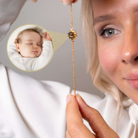 Thumbnail for Woman showcasing the Sun Photo Bracelet from Brother & Sisters with a baby photo charm for cherished memories.