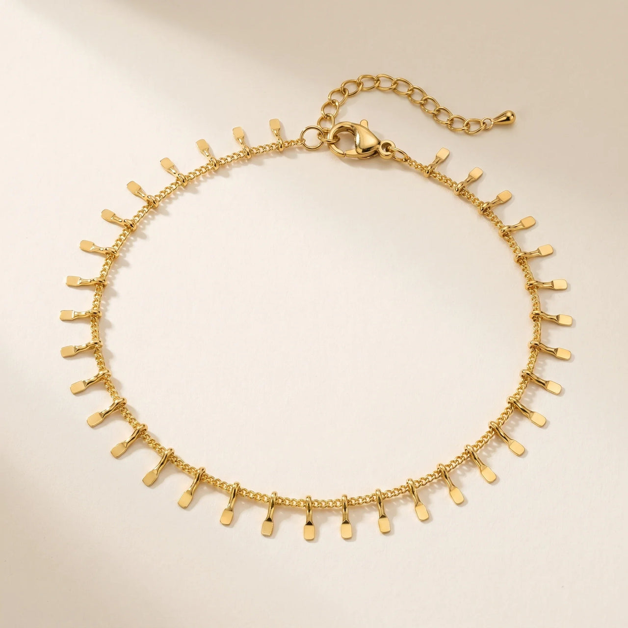 Sun Ray Fringe Anklet featuring a delicate gold cable chain with tiny rectangular sun-ray fringe charms by Brother & Sisters.