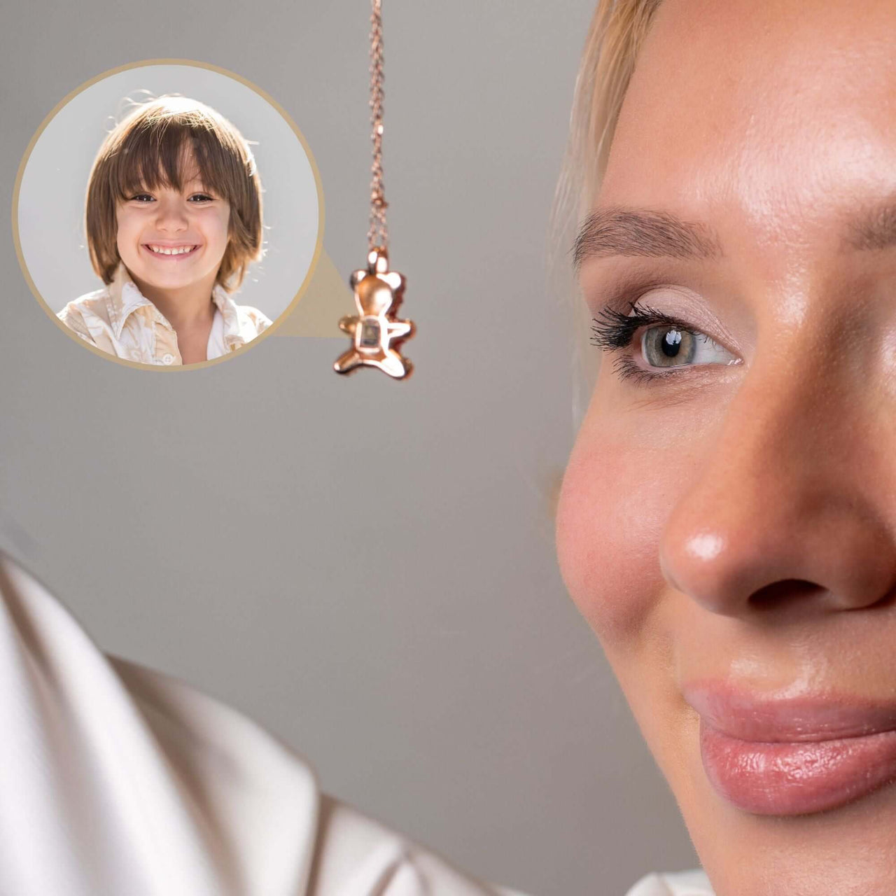 Teddy Bear Photo Necklace showcasing a sentimental projection feature with a close-up of a woman and a child's photo.