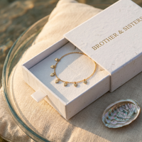 Thumbnail for Tiny Heart Drop Anklet in elegant packaging by Brother & Sisters, showcasing ultra-dainty gold design.