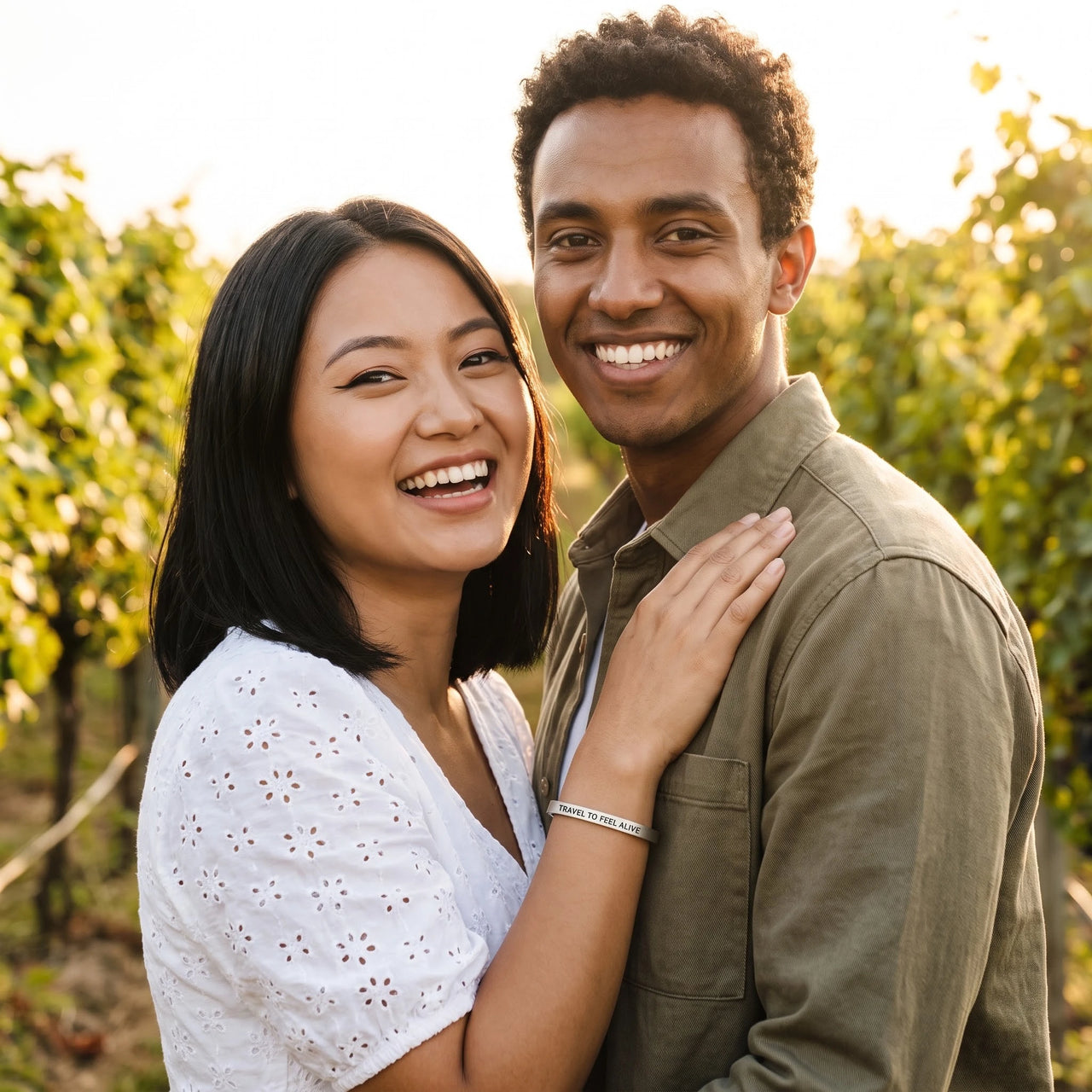 Couple moment, she wears the Travel To Feel Alive bracelet in silver | SKU: ttfa-wg