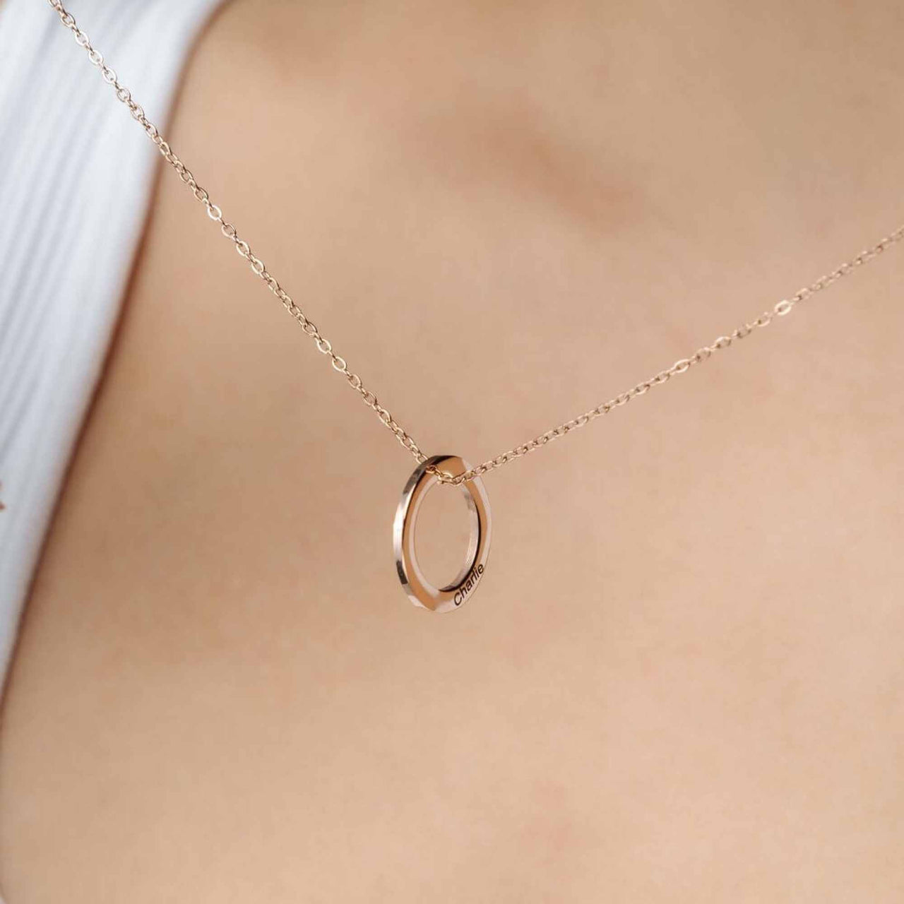 Triple Name Necklace by Brother & Sisters showcasing a custom circular pendant on a delicate chain.