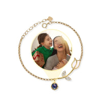 Thumbnail for Tulip Photo Bracelet by Brother & Sisters featuring a tulip charm and a hidden photo projection of loved ones.