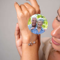 Thumbnail for Tulip Photo Bracelet featuring a delicate tulip charm and hidden photo projection, by Brother & Sisters.